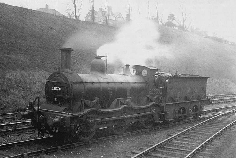 Ex-Midland Railway outside curved frame 0-6-0 No 22630 is seen running light engine through Kings Heath