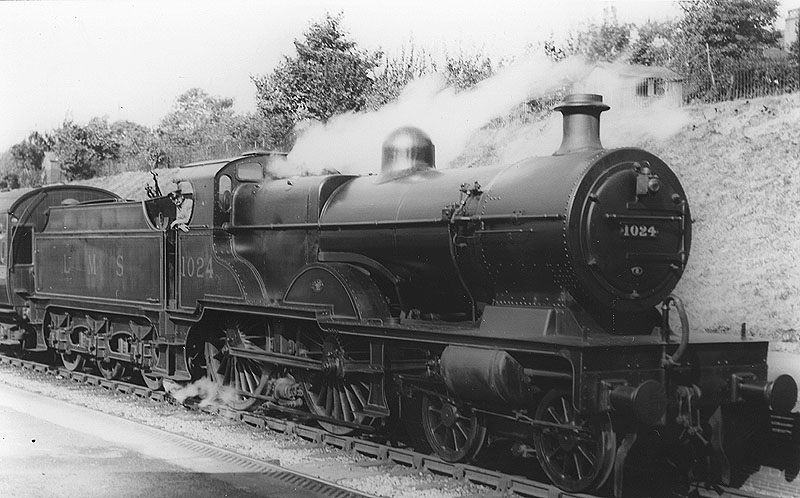 LMS 4-4-0 'Compound' No 1024 is seen blowing off as she readies to depart from Kings Norton station on 7th September 1932