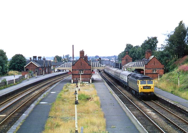 British Railways Brush Type 4 Co-Co D1543 passes through Kings Norton on an up express to New Street station on 3rd August 1969