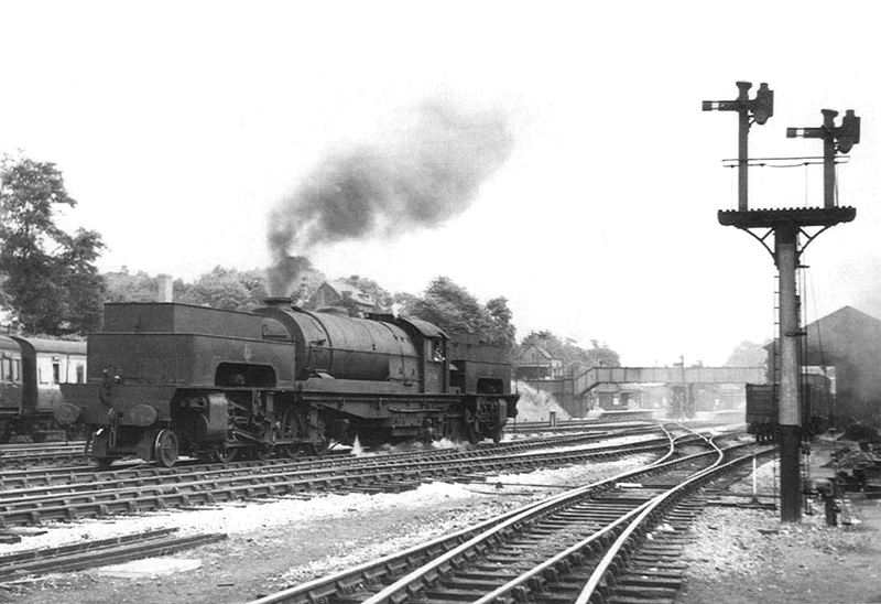 Ex-LNER 2-8-0-0-8-2 Garratt No 69999 is seen passing Kings Norton carriage sidings on its way to be trialed as a Lickey Bank engine on 7th August 1955