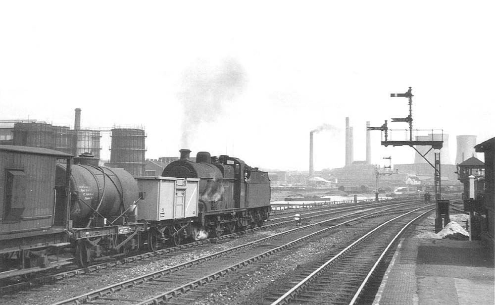 Ex-LMS 0-6-0 4F No 44138 runs tender first past Saltley station on an up working to Washwood Heath sidings on 20th June 1954