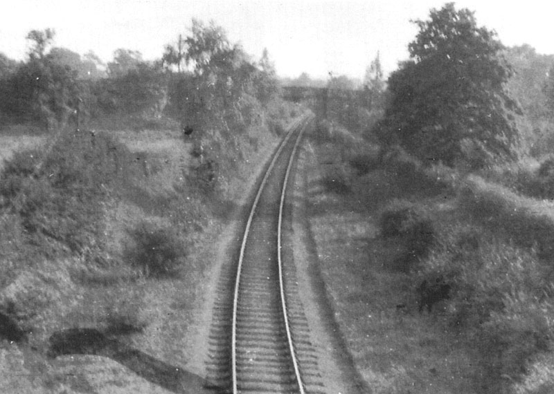 Looking south from Bridge No 1 with the Whitacre distant signal just visible beyond Coleshill Road bridge on 8th August 1916