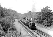 Ex-LMS 4MT 2-6-4T No 42482 at the head of a down six-coach passenger service during 1953