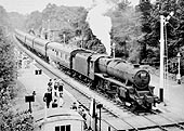 Ex-LMS 5MT 4-6-0 No 45333 passes through the station with empty coaching stock during August 1957