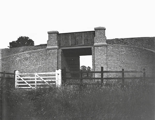 A plate girder occupation overbridge carrying the London Extension over a farm track south of Willoughby station