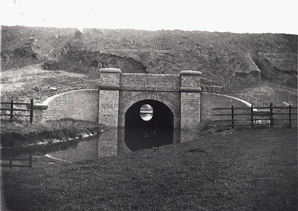 A brick arch underbridge near the Oxford Canal at Rugby built to carry the Great Central over a stream