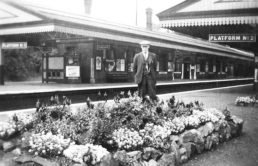 Looking from the main island platform across to the relief island platform showing another floral display on the platform