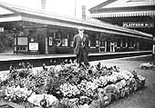 Looking from the main island platform across to the relief island platform showing another floral display on the platform