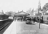 Looking towards Birmingham from the down main platform as passengers alight from an up local train on the up relief line