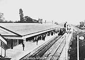 Looking towards Leamington as a local passenger service from Leamington arrives at the down relief platform with the down loop line on its right