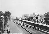 Looking towards Leamington from the Birmingham end of the up platform as a local passenger train for Snow Hill arrives at the down platform