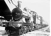 GWR 4-2-2 'Achilles class' No 3050 'Royal Sovereign' is seen standing on the down relief line at the head of a Birmingham bound train