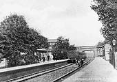 An Edwardian view of Acocks Green station looking towards Birmingham as a local passenger service departs from the down platform