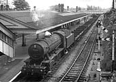 Ex-WD 2-8-0 No 90268 heads an unfitted freight through the station on the down relief lines on 8th May 1961