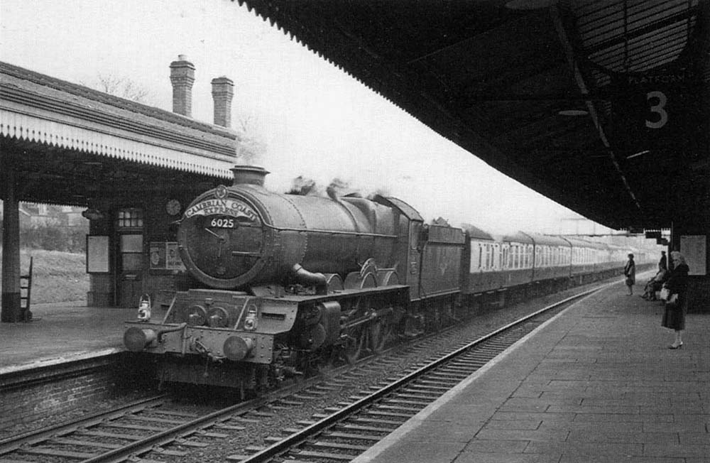 Ex-GWR 4-6-0 60xx Class No 6025 'King Henry III' passes through the station with the 11:10am Paddington to Aberystwyth