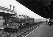 Ex-GWR 4-6-0 60xx Class No 6025 'King Henry III' passes through the station with the 11:10am Paddington to Aberystwyth and Pwllheli on 31st March 1962