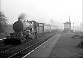 Ex-GWR 4-6-0 4073 Class No 5036 'Lyonshall Castle' passes through the station on a down express in June 1957