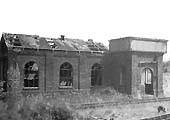 View of the derelict shed and water tank, designed by William Clarke, and built with red brick and slated roof