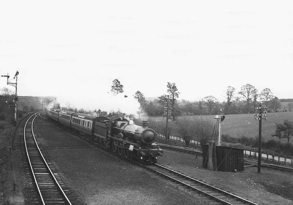 GWR 4-6-0 Saint Class No 2908 'Lady of Quality' is seen at the head of a down West of England express passing the junction