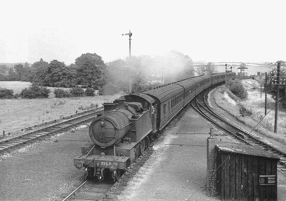 A 3150 class 2-6-2T prairie tank No 3152 passes the Alcester Branch Junction with a Stratford - Birmingham semi-fast