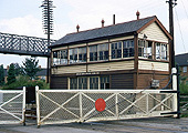 A colour view of Bentley Heath Crossing Signal Box, gates and passenger footbridge on 17th August 1969