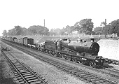 GWR 2-8-0 30xx Class No 3001 steams past Bentley Heath with a southbound freight train in the late afternoon sunshine during 1933