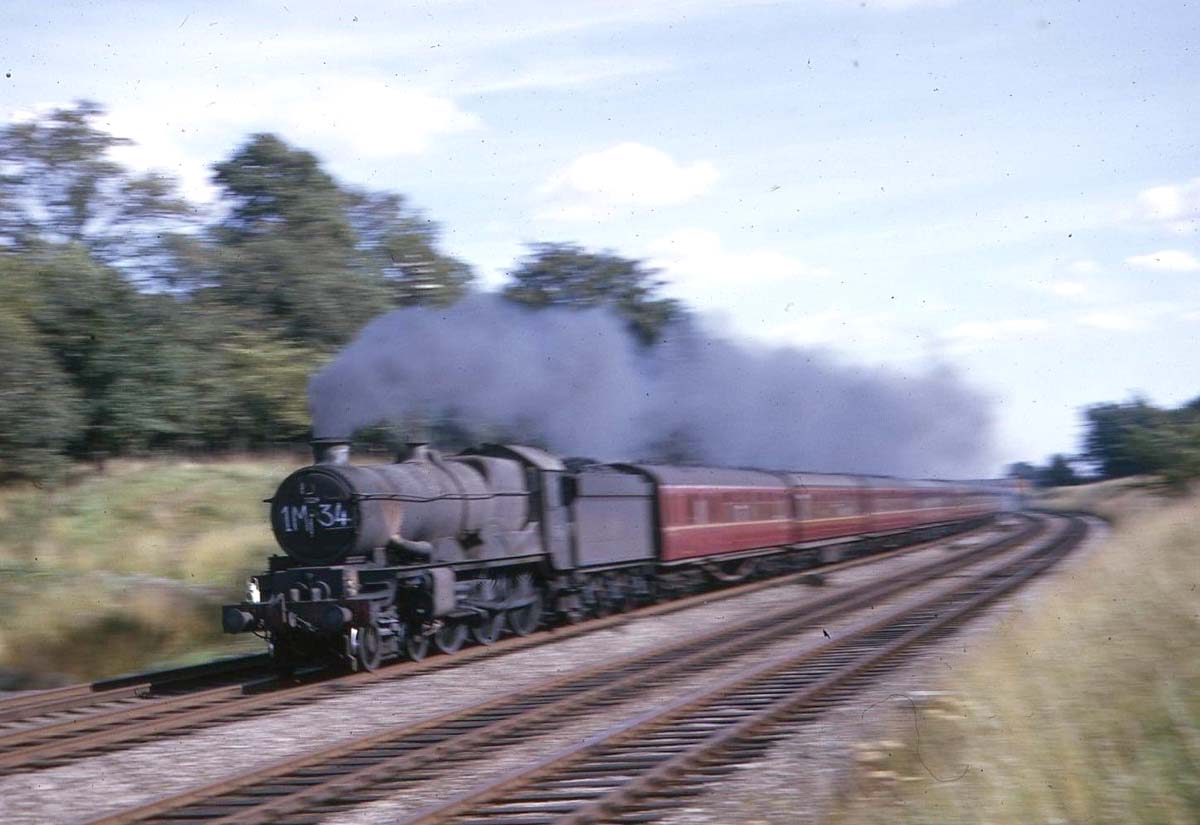 British Railways 5098 (modified Castle) class No 7024 Powis Castle with a northbound express near Bentley Heath on the down main line on Saturday 22nd August 1964