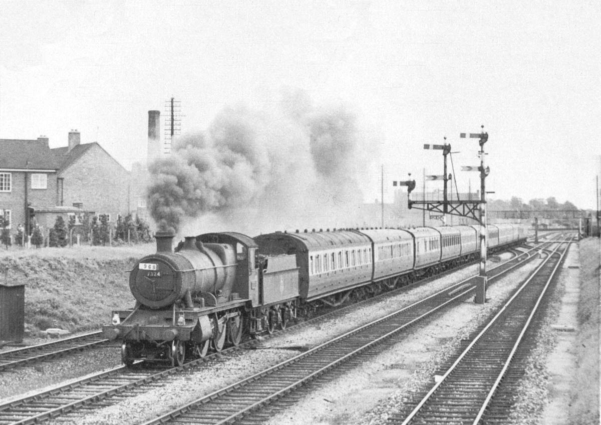 Ex-GWR 2-6-0 43xx Class No 7324 is heading a Margate to Wolverhampton service one Saturday in August 1957