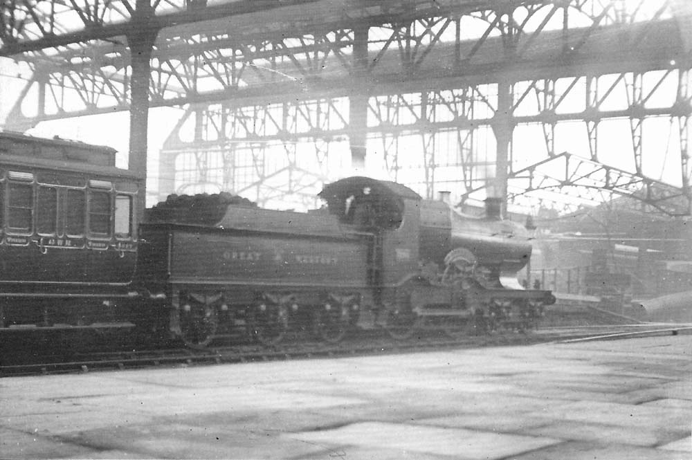 GWR 4-4-0 Badmington class No 3294 'Blenheim' is seen at the head of a down express at Platform 6 during the rebuilding of Snow Hill station