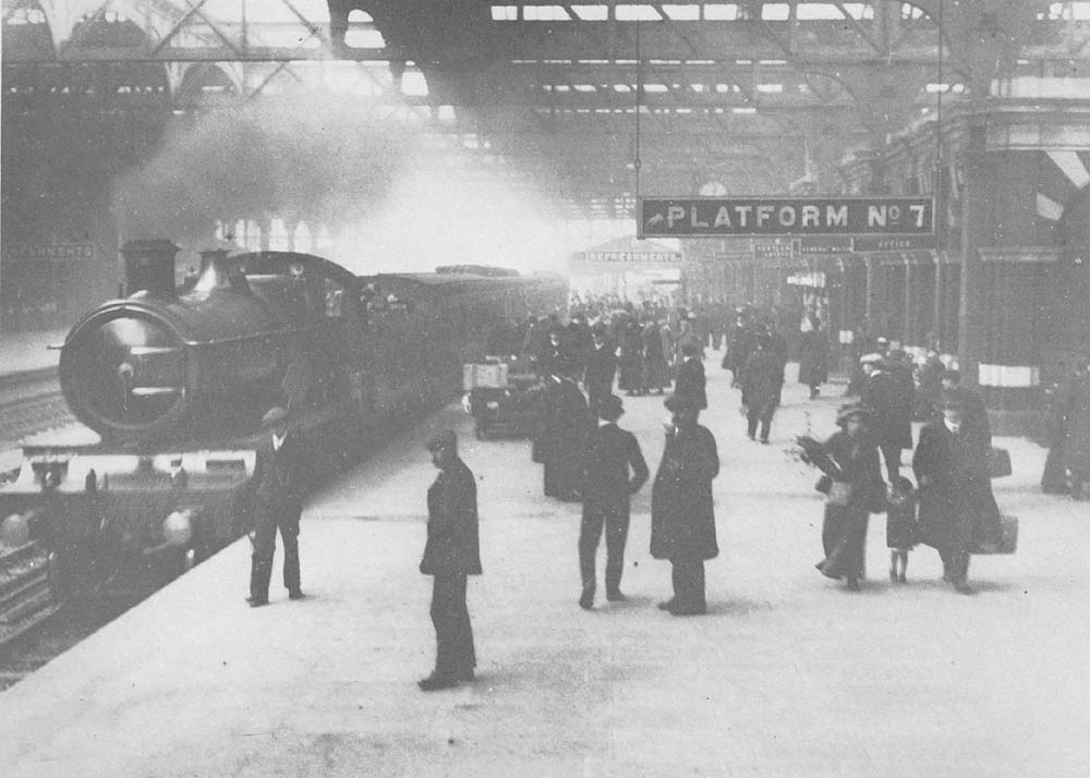 GWR 4-4-0 County class No 3828 'County of Hereford' is seen arriving at Platform 7 and 8 whilst working an up express service to London