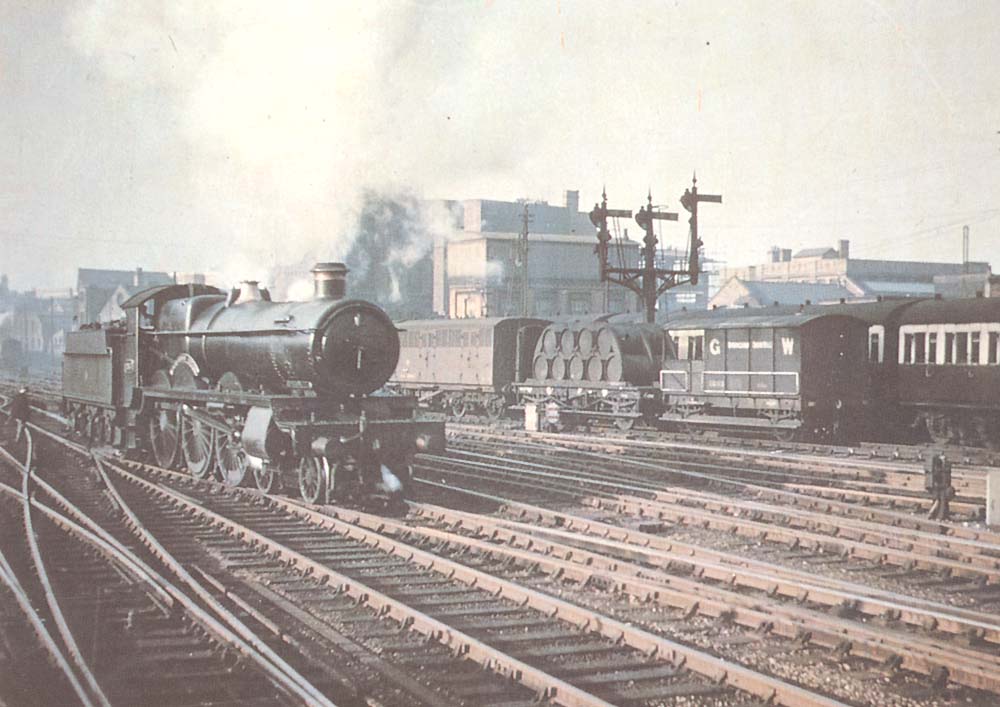 GWR 4-6-0 Saint class No 2937 is seen running light engine as it crosses over to the up through road to take forward an express service to Paddington