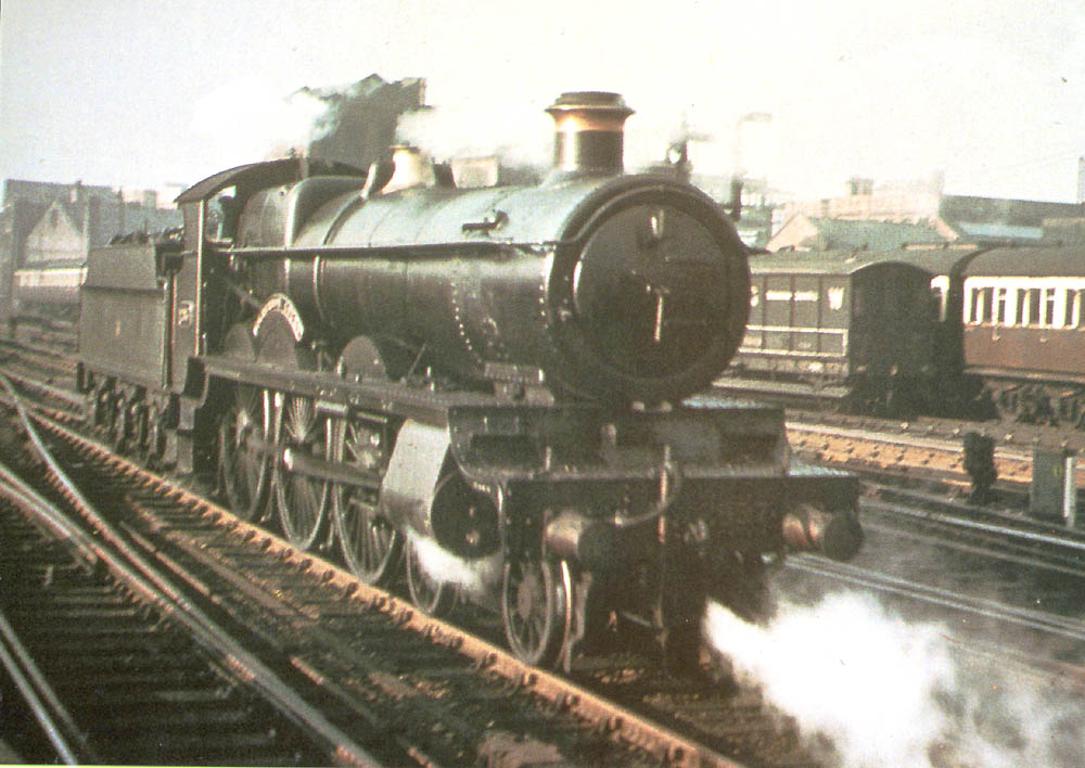 GWR 4-6-0 Saint class No 2937 'Clevedon Court' is seen light engine passing the sidings that lay at the North end of Snow Hill station in August 1939