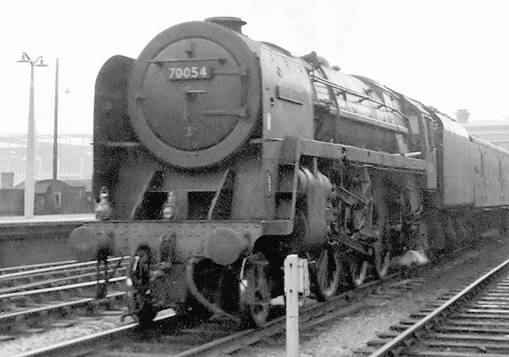 British Railways 4-6-0 Standard Class 7MT No 70054 'Dornoch Firth' is seen at the head of the 1 15pm Morris Cowley to Bathgate car train