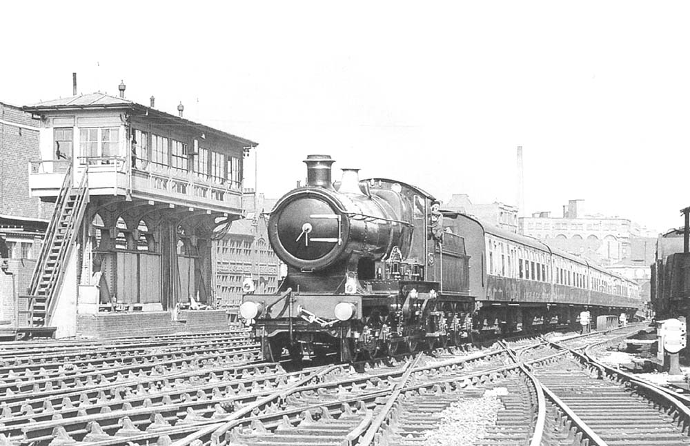 Ex-GWR 4-4-0 City class No 3440 'City of Truro' is seen at the head of an up enthusiasts special as it passes Snow Hill's North Signal Box