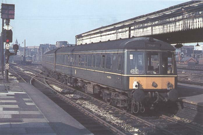 A British Railways DMU made up of 'Derby Suburban' units is seen arriving at Bay Platform 4 ready to form the 1 05pm to Kidderminster on 24th October 1966