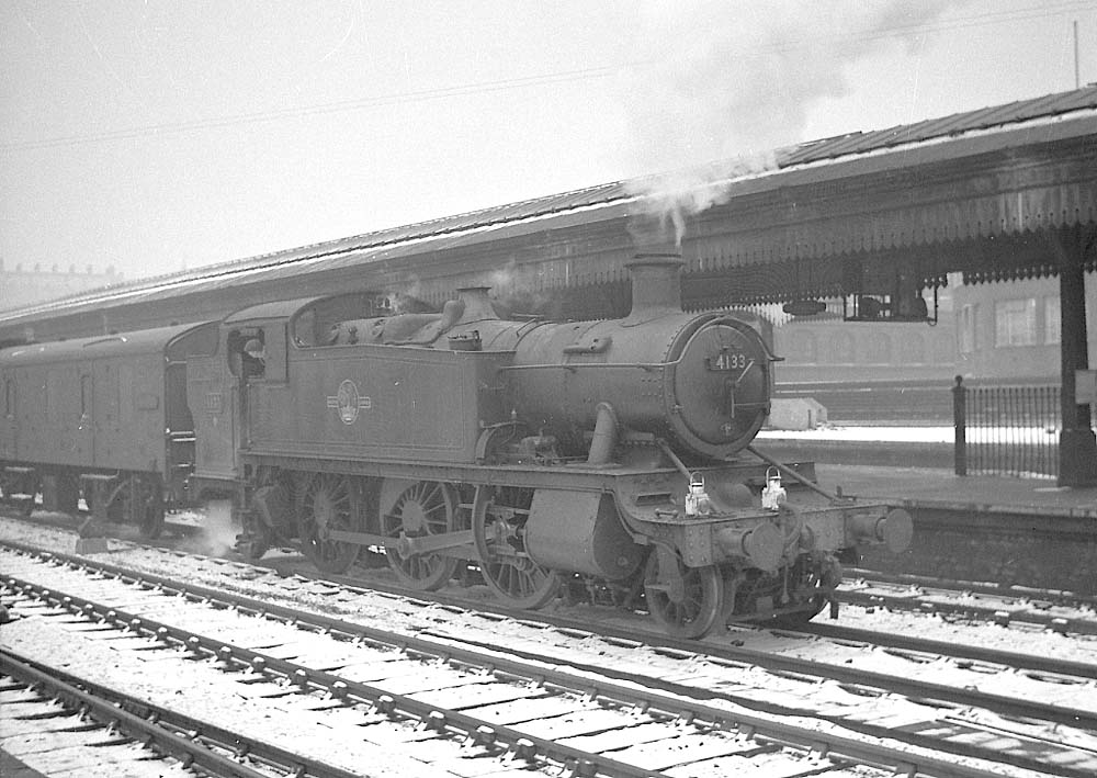 Ex-GWR 2-6-2T Large Prairie No 4133 is seen with snow on the ground standing on Snow Hill's down through road whilst at the head of a Class C vacuum fitted train
