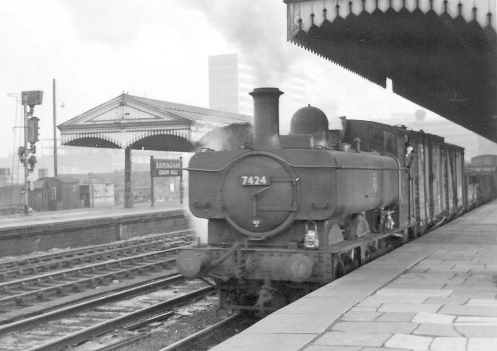 Ex-GWR 0-6-0PT 74xx class No 7424, one of the former GWR's many Pannier Tank locomotives, is seen passing through Platform 5 whilst at the head of a down Class K freight train
