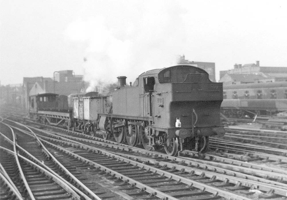 British Railways built 2-6-2T Large Prairie No 4179 is seen running bunker first on Snow Hill's up through road at the head of a Class J empty mineral wagon working
