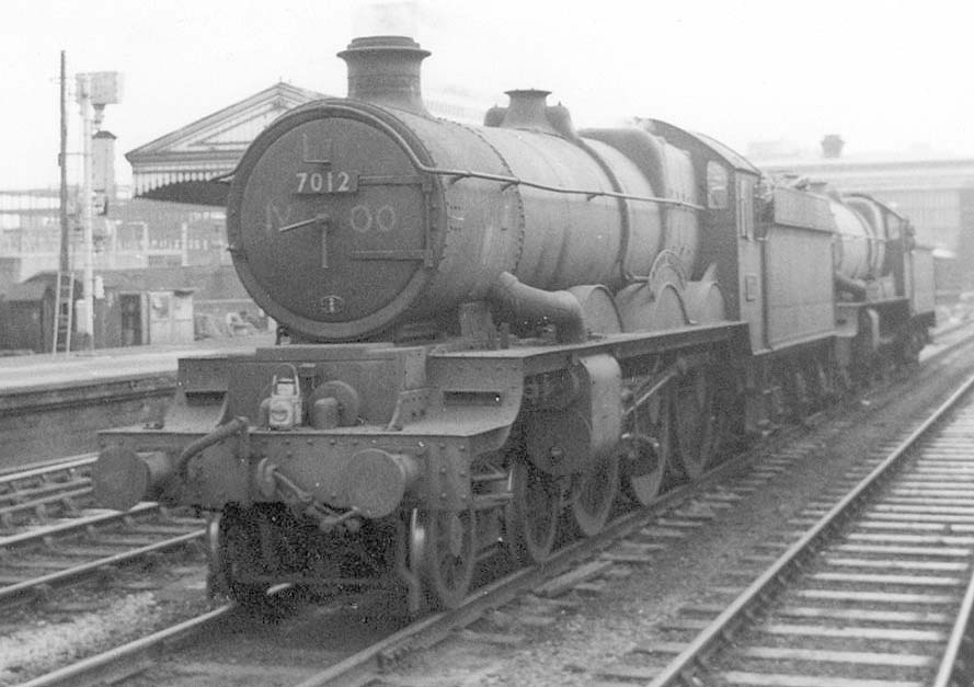 British Railways built 4-6-0 Castle class No 7012 'Barry Castle' is seen enroute to the breakers yard with ex-GWR 4-6-0 King class No 6005 'King George II' in March 1963