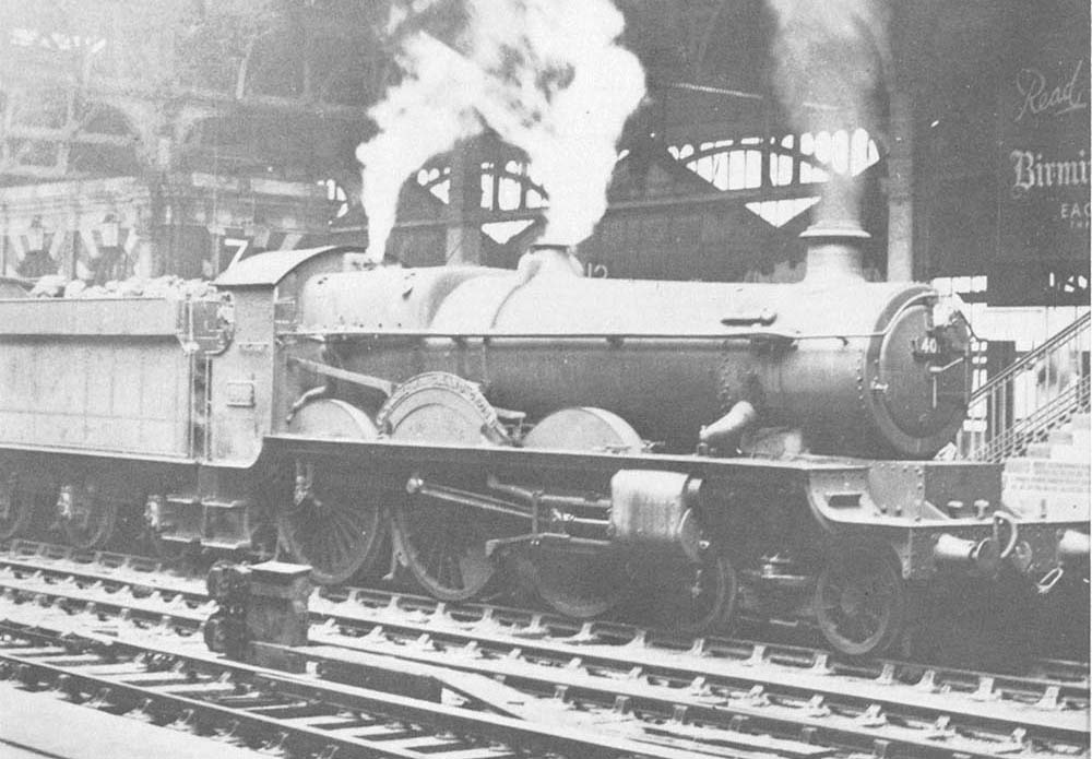 Ex-GWR 4-6-0 Star class No 4013 'Knight of St Patrick' is seen standing at Platform 7 whilst at the head of a Class B up local passenger service