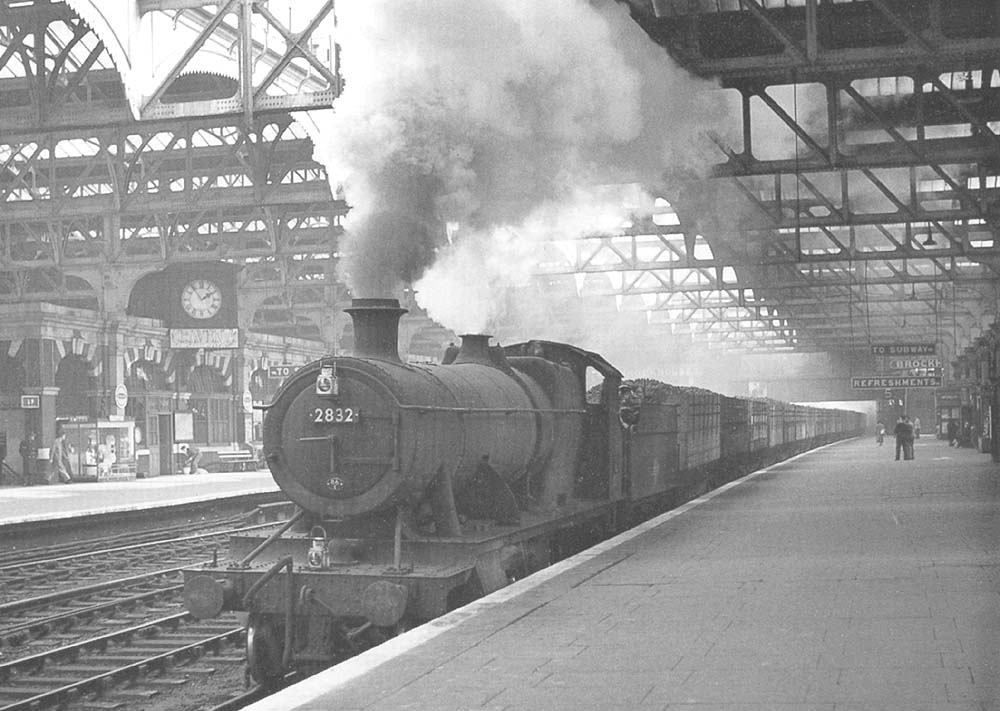 Ex-GWR 2-8-0 28xx class No 2832 is seen working hard as it passes through Platform 7 whilst at the head of a Class H through freight service