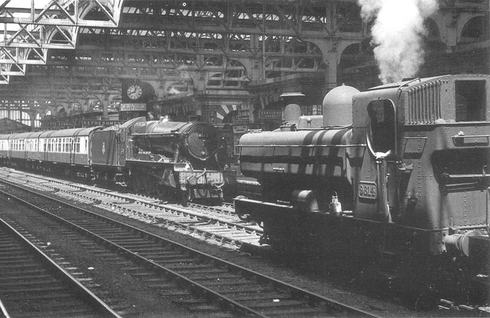 Ex-GWR 4-6-0 County class No 1022 'County of Northampton' is seen arriving with the 9 20am Birkenhead Woodside to Bournemouth West express on 17th June 1957