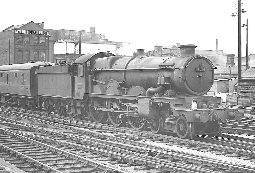 British Railways built 4-6-0 'Castle class' No 7014 'Caerhays Castle' enter Snow Hill station on an up express on 7th April 1964