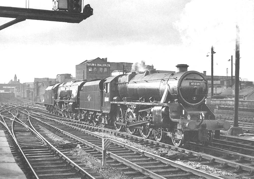 Ex-LMS 4-6-0 5MT No 45039 and ex-LMS 4-6-2 Coronation Class No 46235 'City of Birmingham' approach Snow Hill station on 19th May 1966