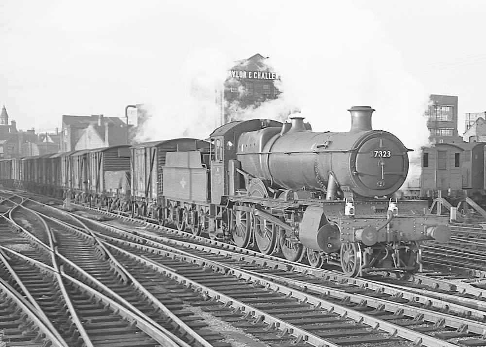 British Railways built 4-6-0 78xx class No 7823 'Hook Norton Manor' heads an up freight working on 23rd November 1963