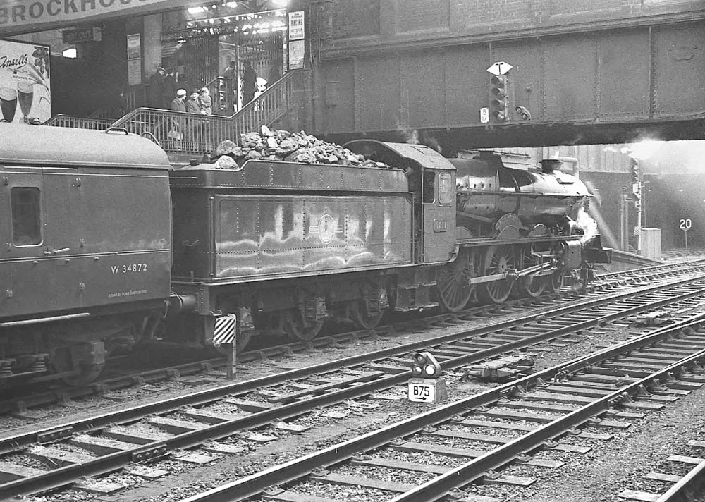 Ex-GWR 4-6-0 No 6011 'King James l' stands at platform 7 on the 09:00 hours up express to Paddington on 14th April 1962
