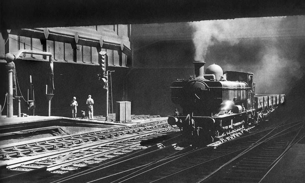 Ex-GWR 0-6-0PT No 8737 emerges out of the black depths of Snow Hill Tunnel, with a trip freight from Bordesley to Hockley on 4th July 1959