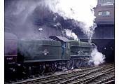A colourisation of ex-GWR 0-6-0PT No 8737 emerging out of the black depths of Snow Hill Tunnel