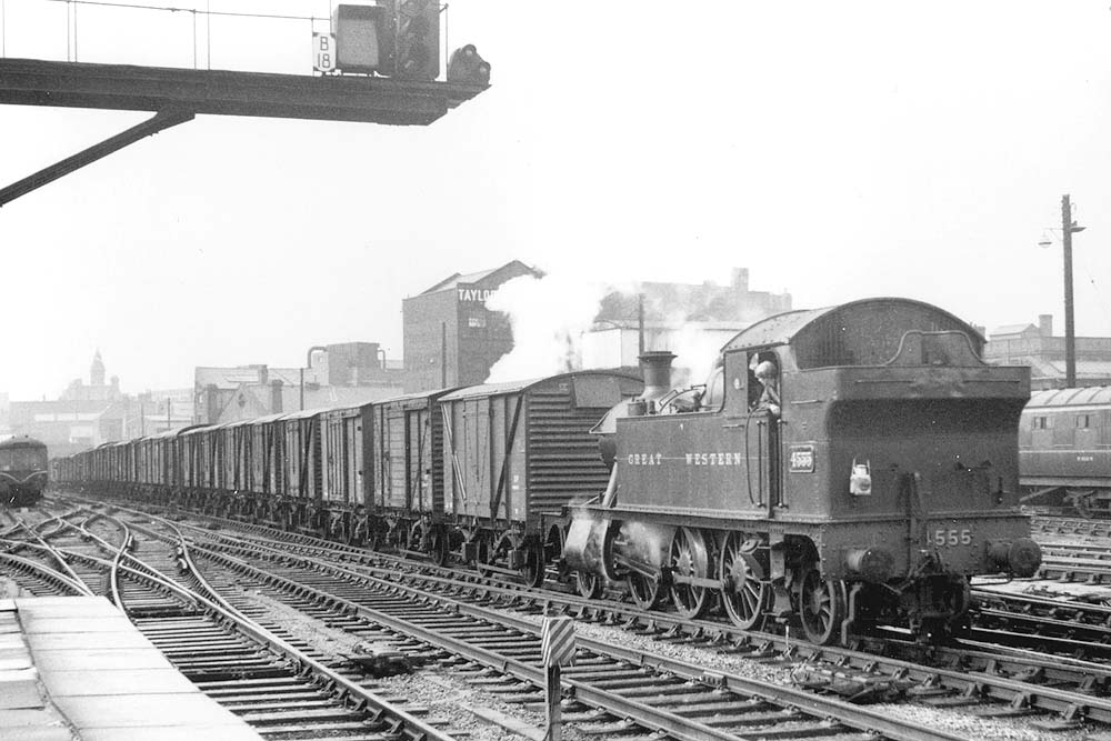 Ex-GWR 2-6-2T 'Small Prairie' No 4555 is seen running bunker first through Snow Hill station's up middle through road at the head of a Class J empty freight train service