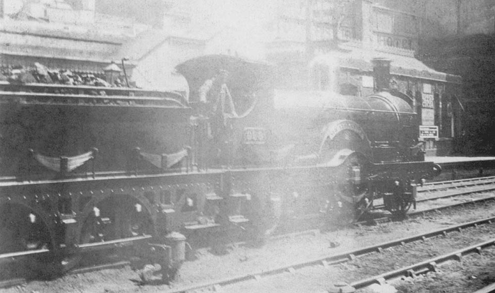 GWR 2-2-2 Dean Single No 999 'Sir Alexander' is seen standing light engine on the centre up road at the North end of Snow Hill station